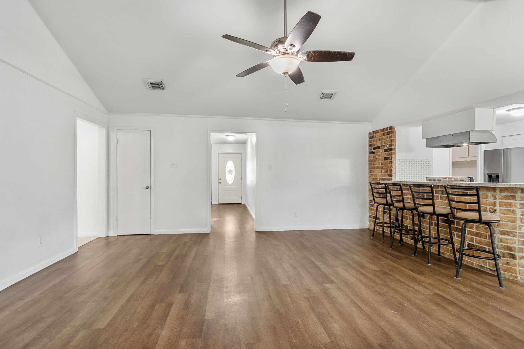 9726 John Bank Drive Spring, TX 77379 - Photo 19 of 36 The view from the family room to the front door.