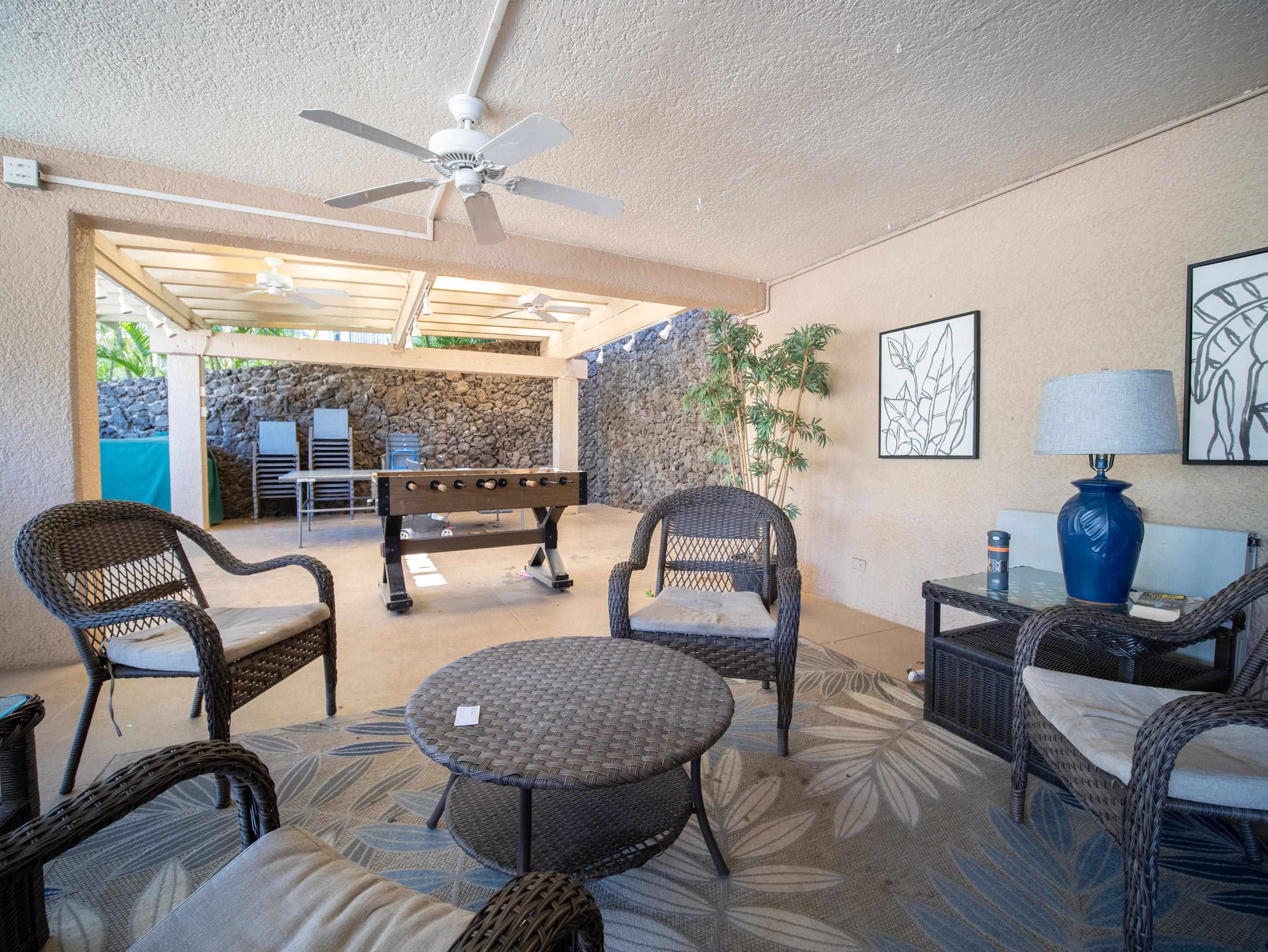 2695 South Kihei Road, Unit 7204 Kihei, HI 96753 - Photo 23 of 32 a living room with furniture a table and a large window