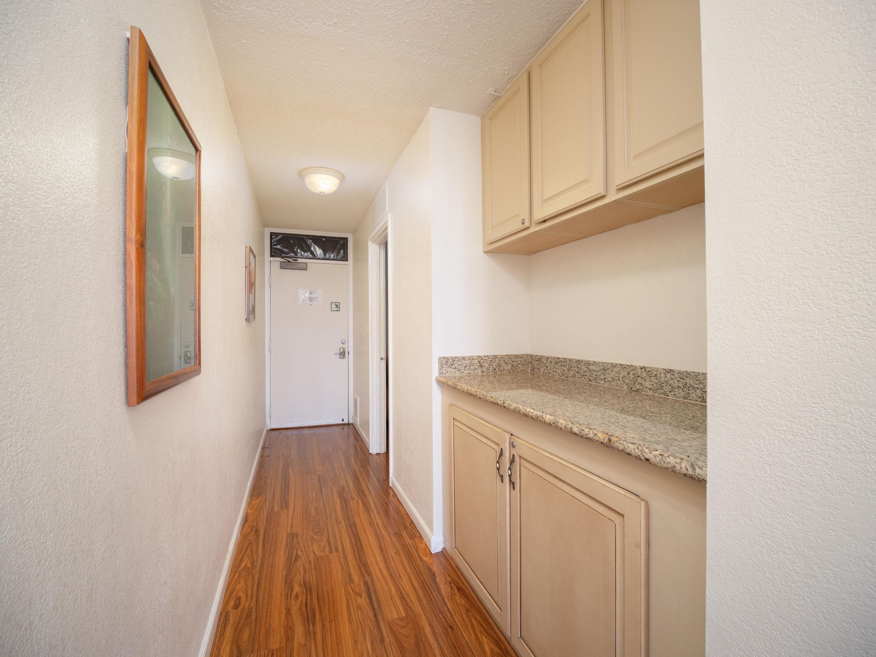2695 South Kihei Road, Unit 7204 Kihei, HI 96753 - Photo 9 of 32 a view of a kitchen from the hallway