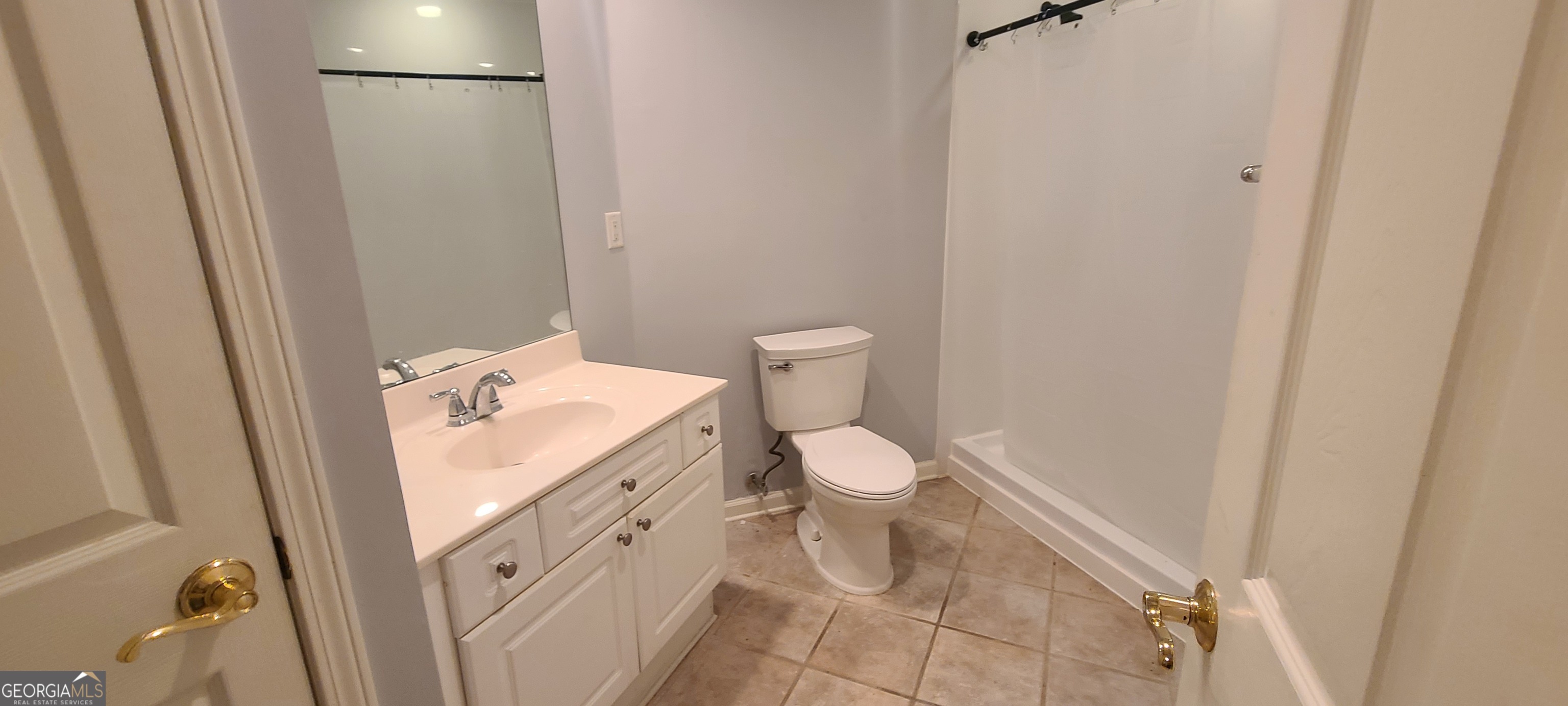 3047 Lenox Road Northeast, Unit 2107 Atlanta, GA 30324 - Photo 11 of 27 a bathroom with a toilet and a sink