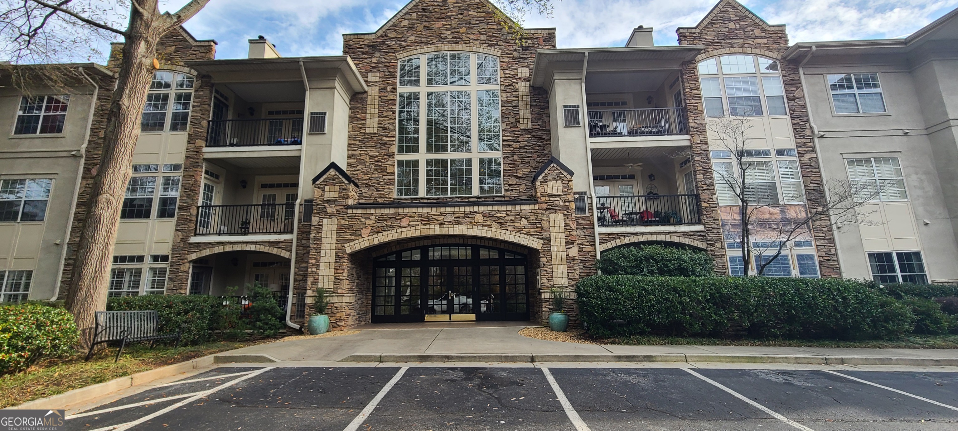 3047 Lenox Road Northeast, Unit 2107 Atlanta, GA 30324 - Photo 18 of 27 a front view of a house with yard