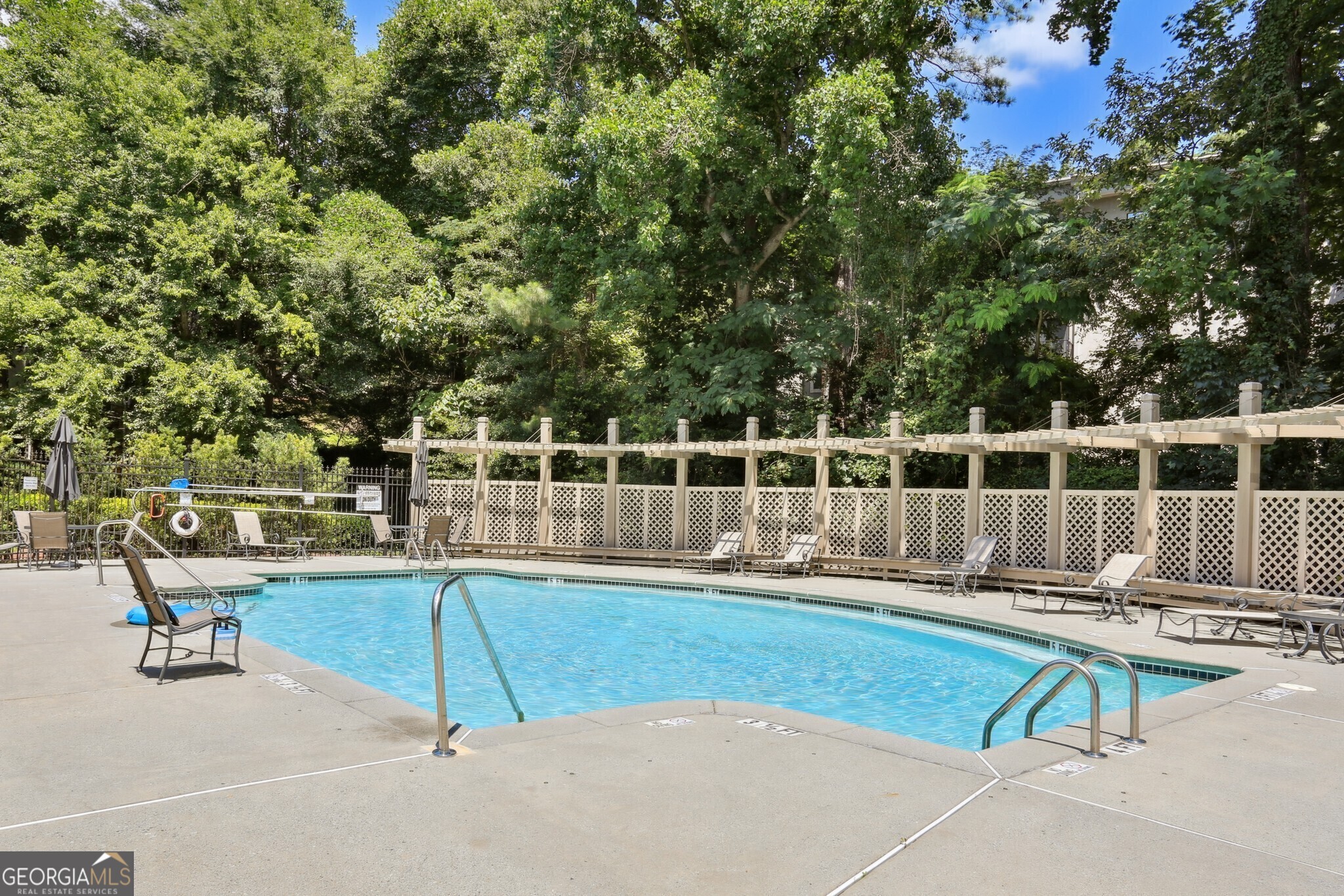 3047 Lenox Road Northeast, Unit 2107 Atlanta, GA 30324 - Photo 27 of 27 a view of a house with swimming pool and sitting area