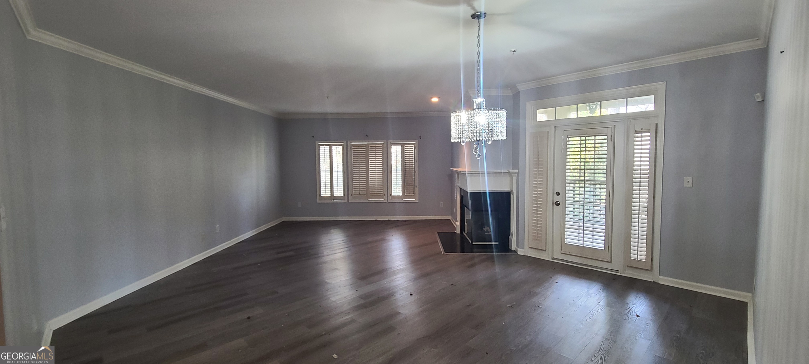 3047 Lenox Road Northeast, Unit 2107 Atlanta, GA 30324 - Photo 4 of 27 a view of a room with wooden floor and fireplace
