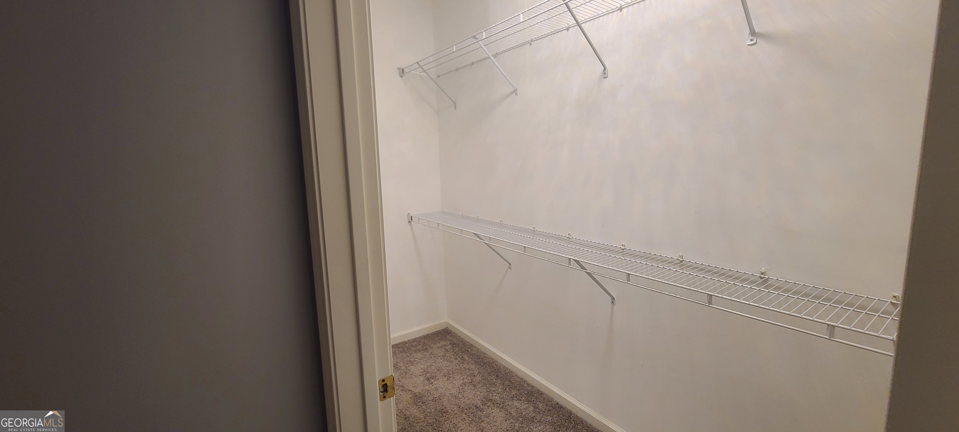 3047 Lenox Road Northeast, Unit 2107 Atlanta, GA 30324 - Photo 7 of 27 a view of small space with racks on the wall