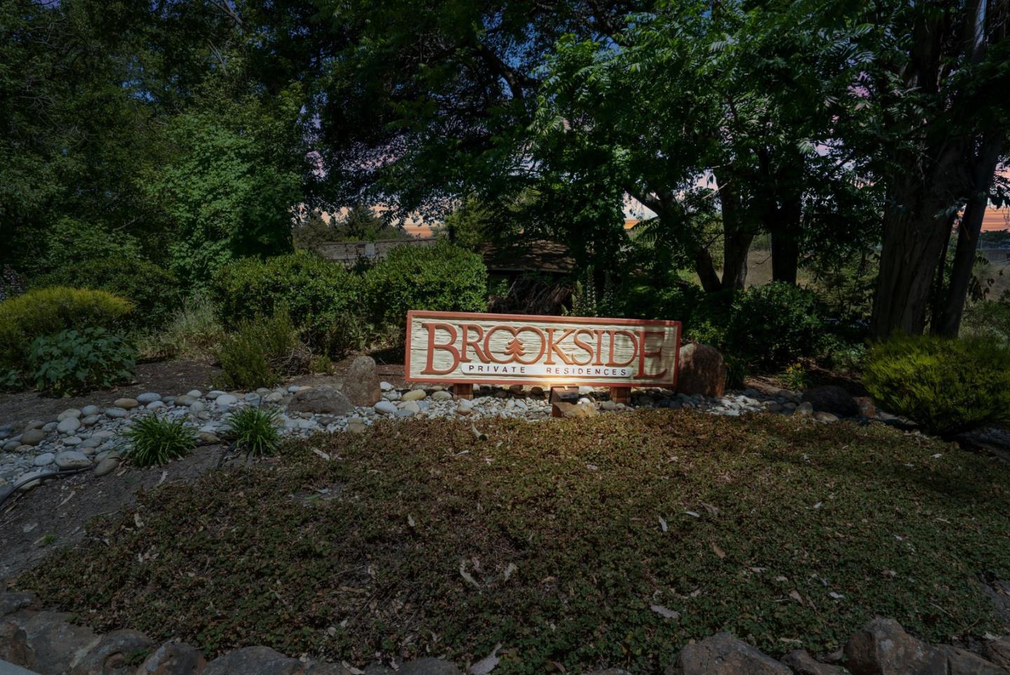 103 Stoney Creek Road Santa Cruz, CA 95060 - Photo 2 of 44 a sign that is sitting in the middle of a forest