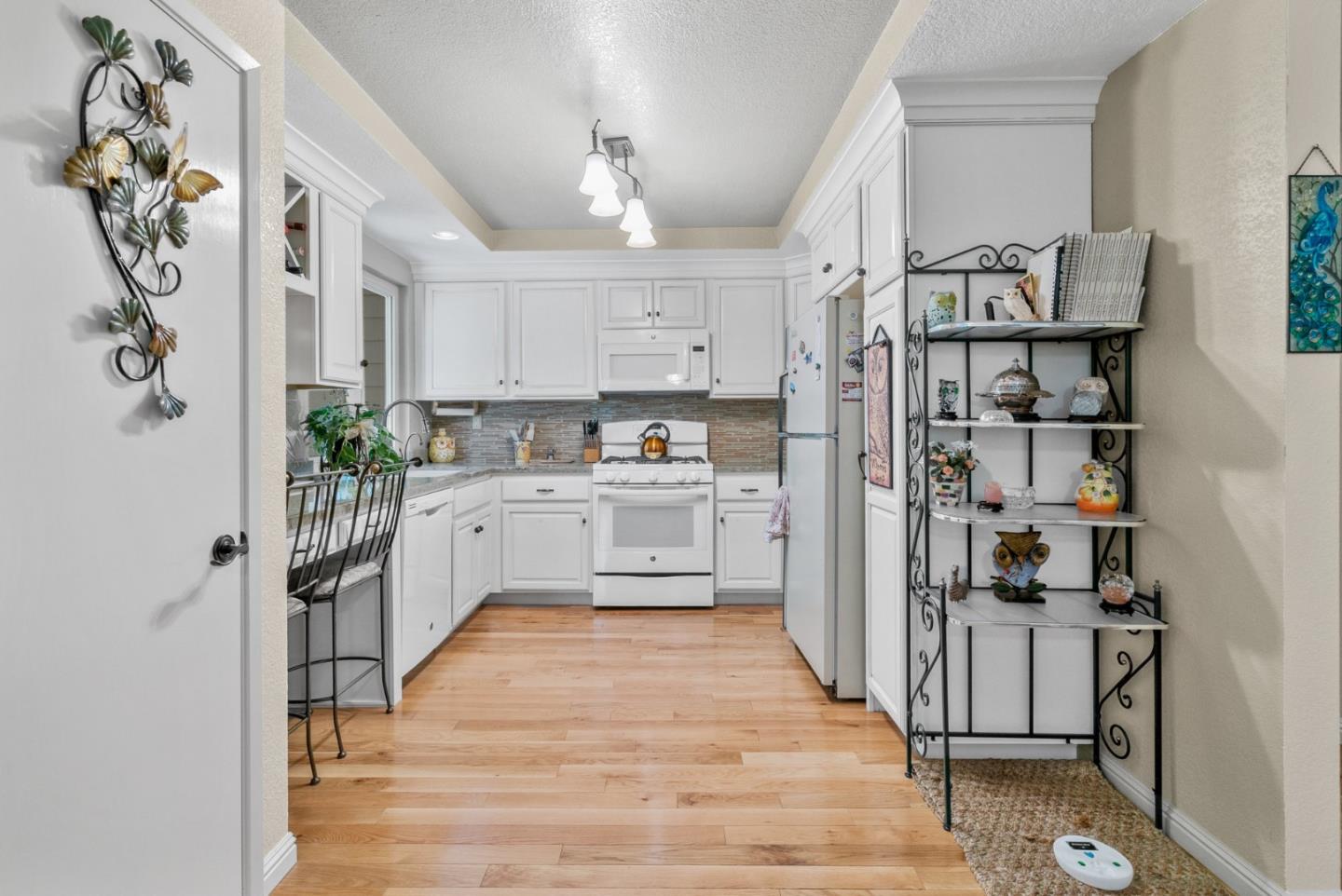 103 Stoney Creek Road Santa Cruz, CA 95060 - Photo 18 of 44 a kitchen with stainless steel appliances a refrigerator sink and cabinets