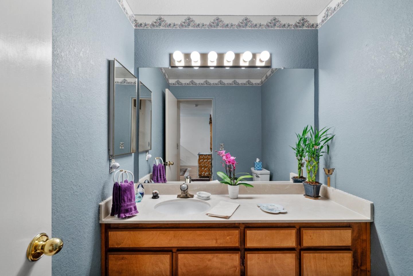 103 Stoney Creek Road Santa Cruz, CA 95060 - Photo 22 of 44 a view of a dining room with furniture and a chandelier