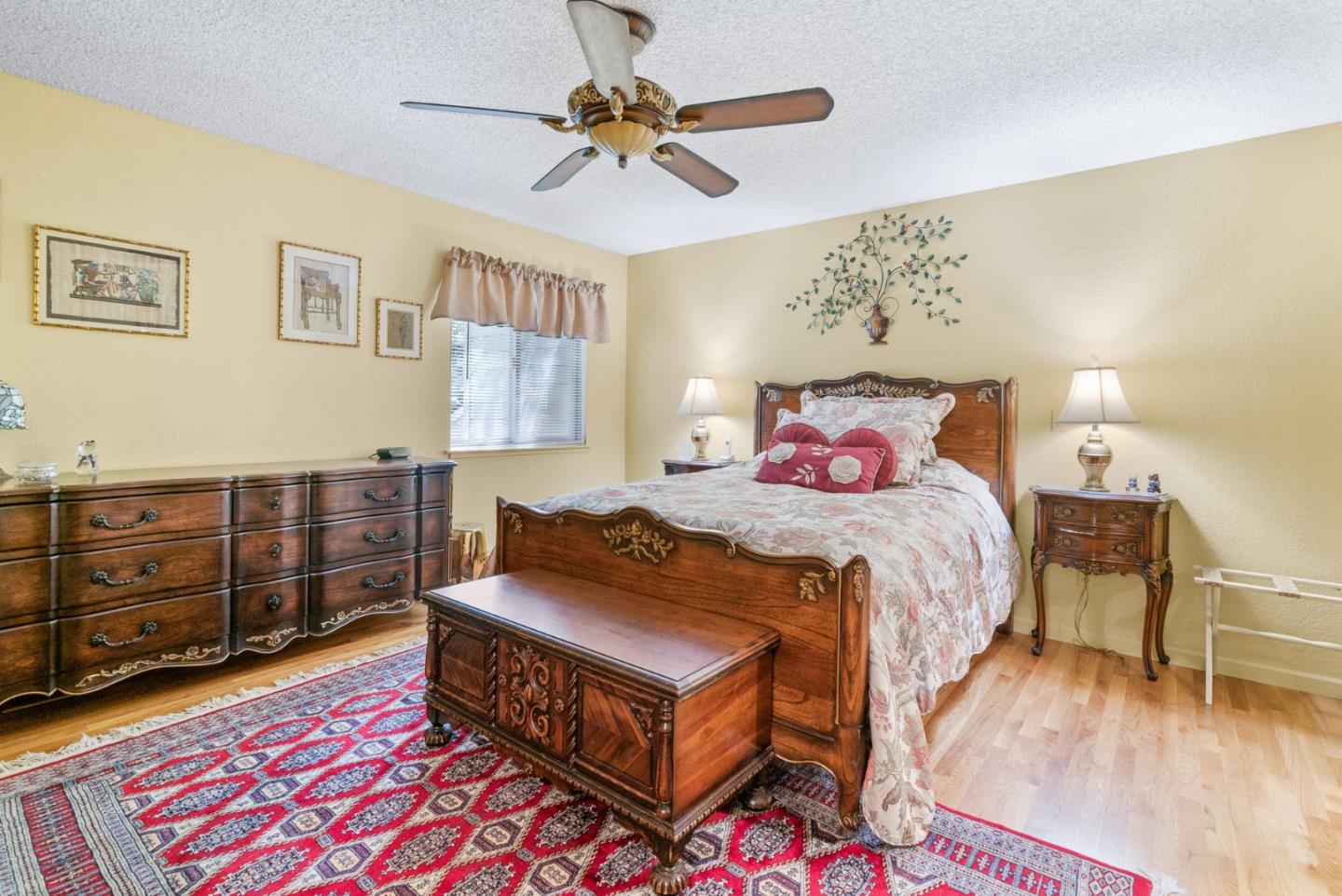 103 Stoney Creek Road Santa Cruz, CA 95060 - Photo 24 of 44 a bedroom with a bed and a chandelier