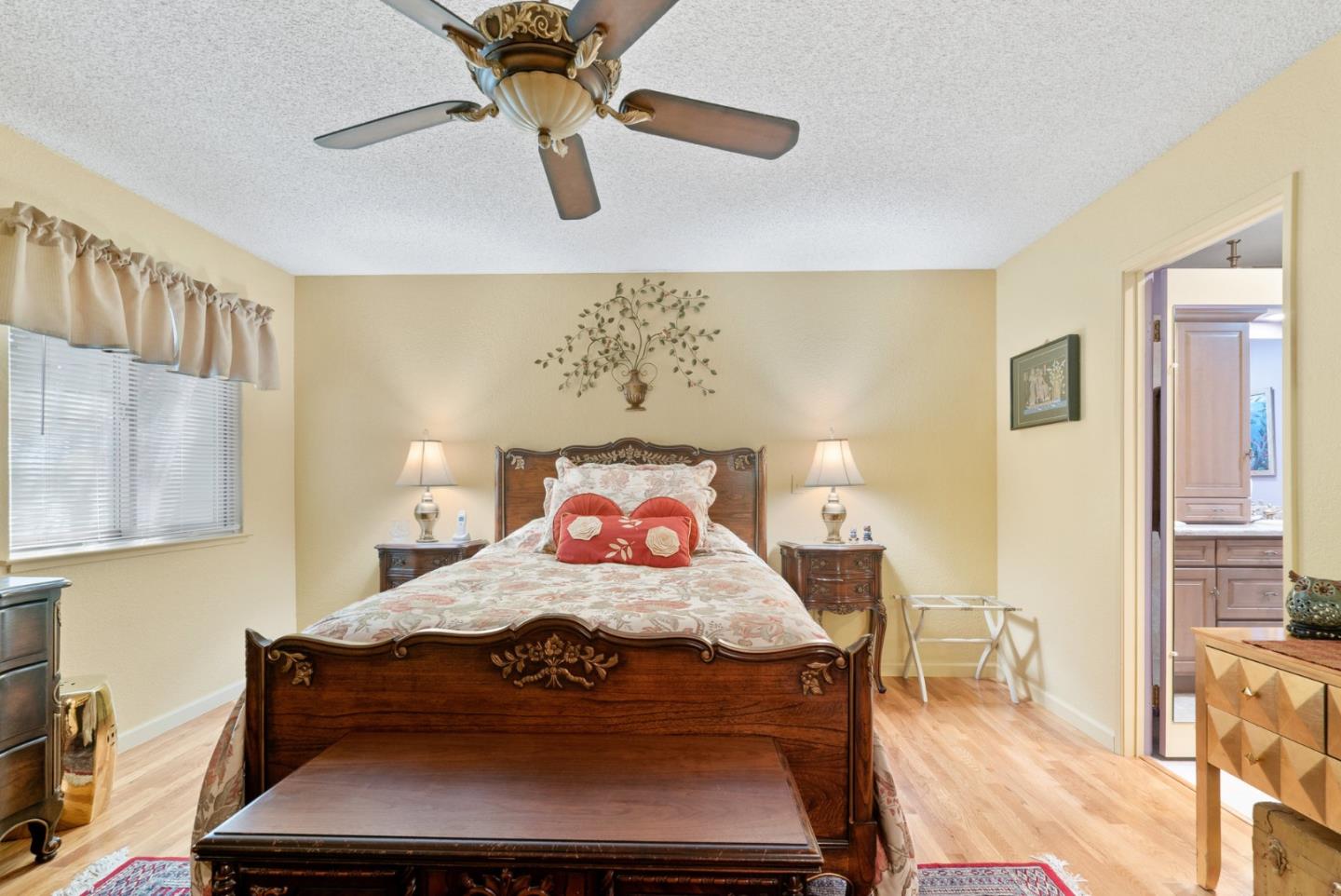 103 Stoney Creek Road Santa Cruz, CA 95060 - Photo 25 of 44 a bedroom with a bed and wooden floor