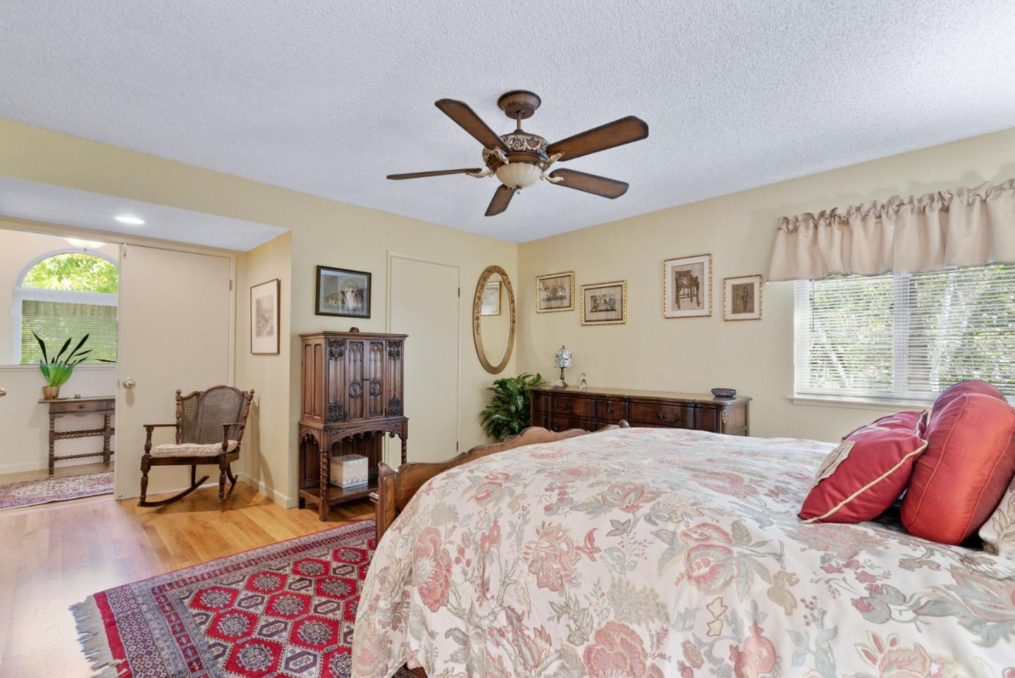 103 Stoney Creek Road Santa Cruz, CA 95060 - Photo 28 of 44 a bedroom with a bed a chandelier and a window