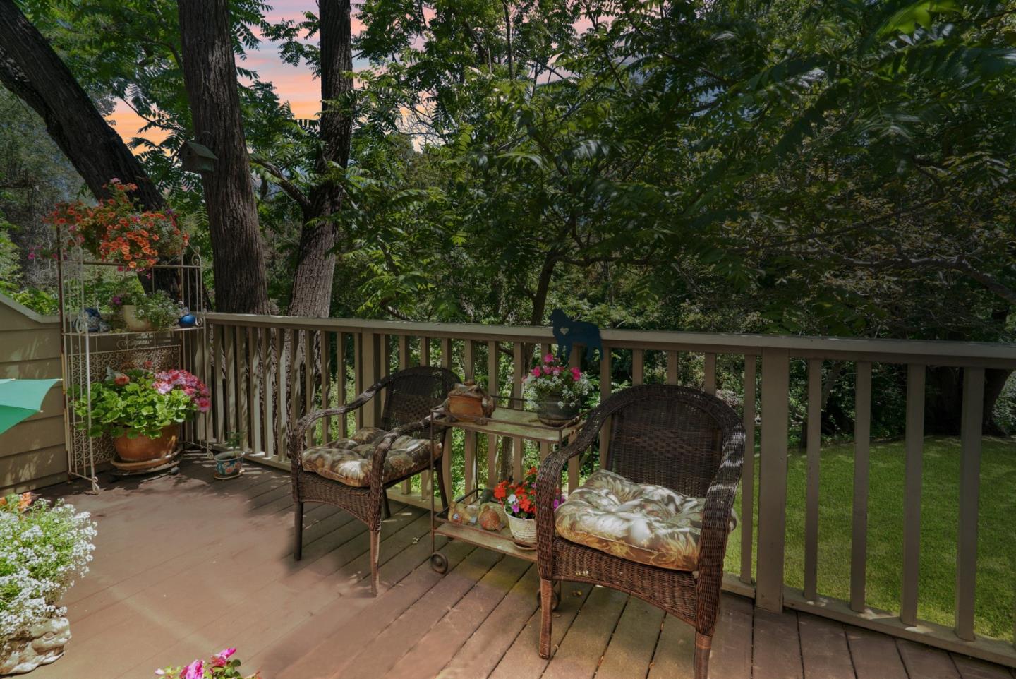 103 Stoney Creek Road Santa Cruz, CA 95060 - Photo 4 of 44 a view of a chair and table on the wooden deck