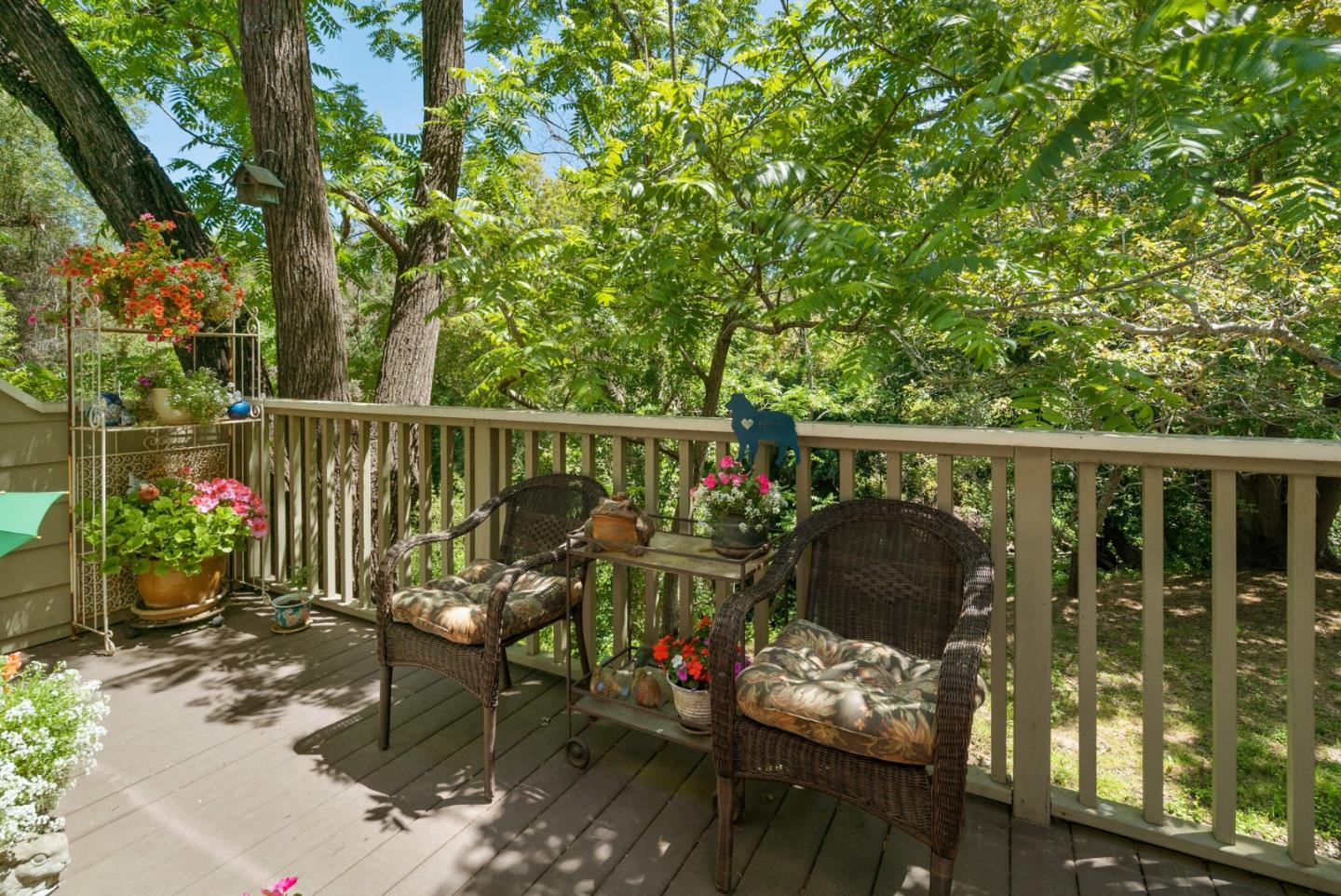 103 Stoney Creek Road Santa Cruz, CA 95060 - Photo 36 of 44 a view of a deck with couches table and chairs and potted plants