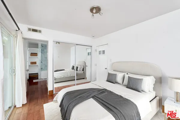 a bedroom with a bed and a view of bedroom