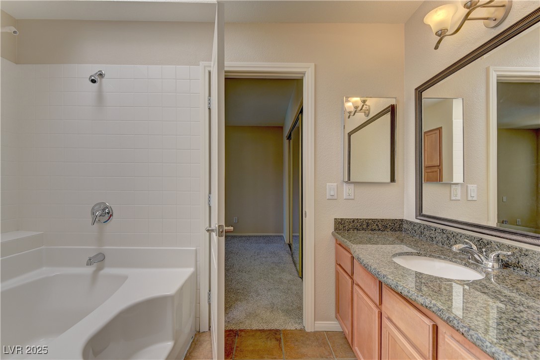 3145 East Flamingo Road, Unit 2080 Las Vegas, NV 89121 - Photo 15 of 26 Full bath with vanity, bathtub / shower combination, and tile patterned floors