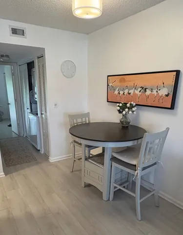 a view of a table and chairs in a room
