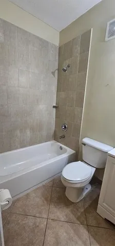 a kitchen sink with granite countertop a sink and a stove