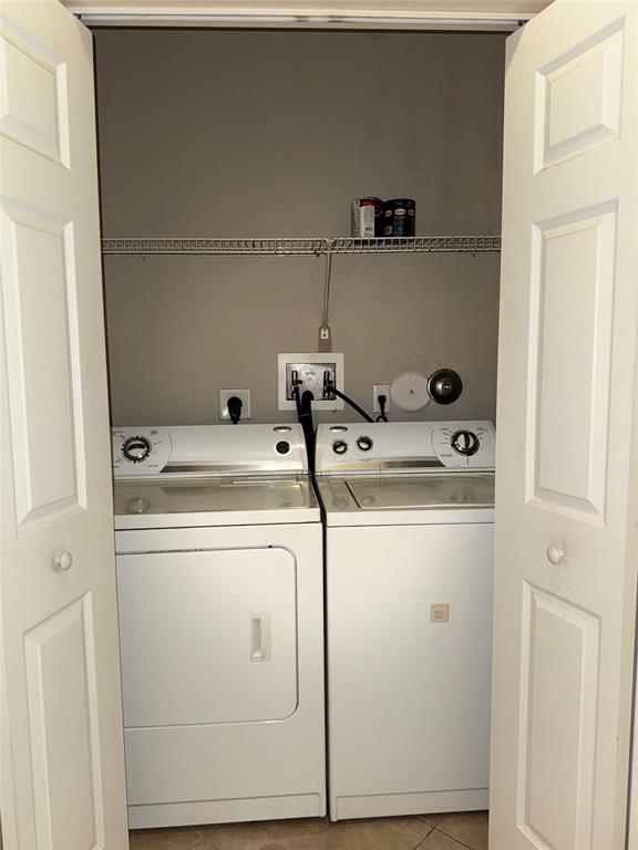 9073 Plymouth Place Tamarac, FL 33321 - Photo 14 of 16 a utility room with dryer and washer