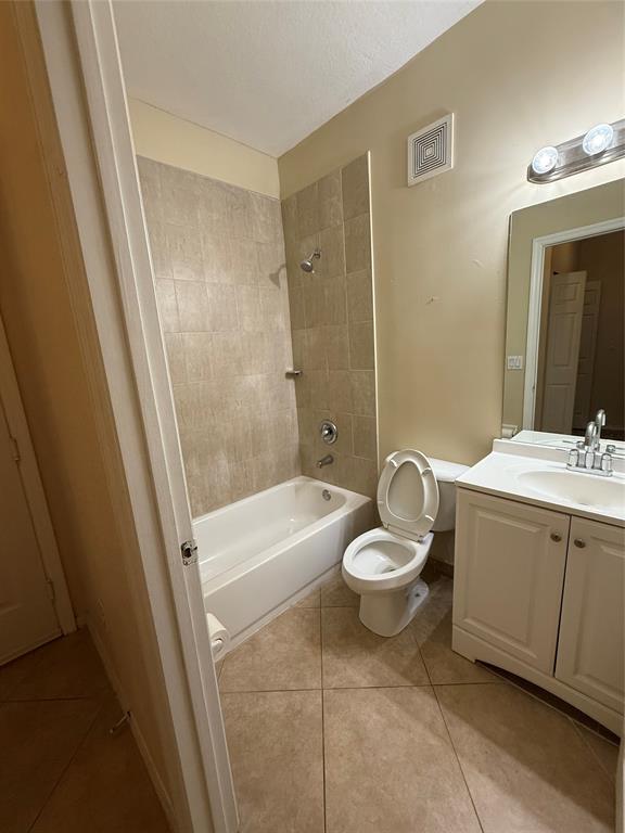 9073 Plymouth Place Tamarac, FL 33321 - Photo 15 of 16 a bathroom with a sink a toilet and shower