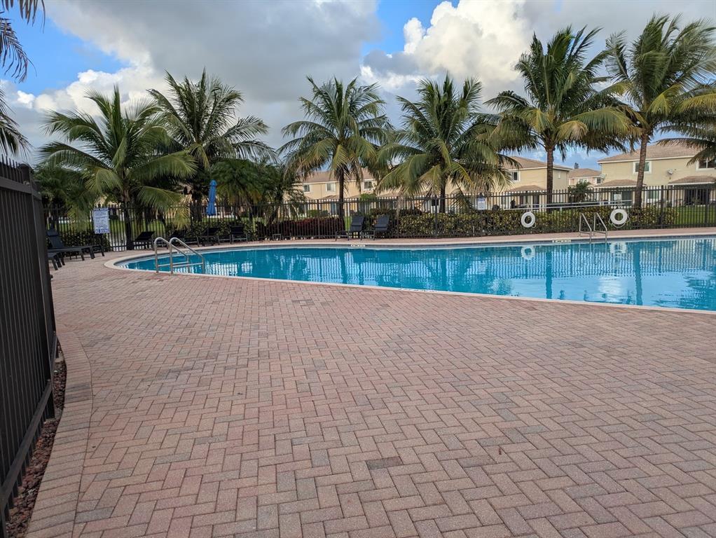 9073 Plymouth Place Tamarac, FL 33321 - Photo 3 of 16 a view of outdoor space with palm trees