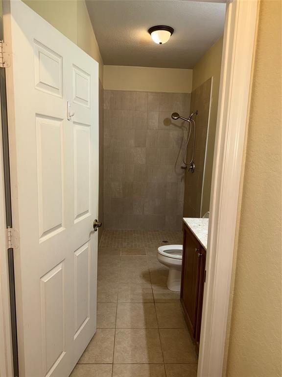 9073 Plymouth Place Tamarac, FL 33321 - Photo 5 of 16 a bathroom with a granite countertop shower and a toilet