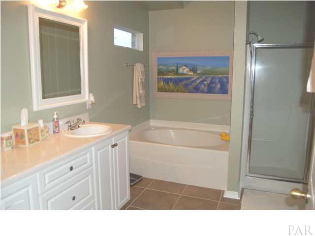 7185 Woodside Road Pensacola, FL 32526 - Photo 12 of 19 Master bathroom with double vanity, garden tub and separate enclosed shower