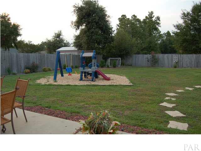 7185 Woodside Road Pensacola, FL 32526 - Photo 16 of 19 Back yard with play set