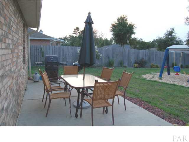7185 Woodside Road Pensacola, FL 32526 - Photo 17 of 19 Back yard with patio area.