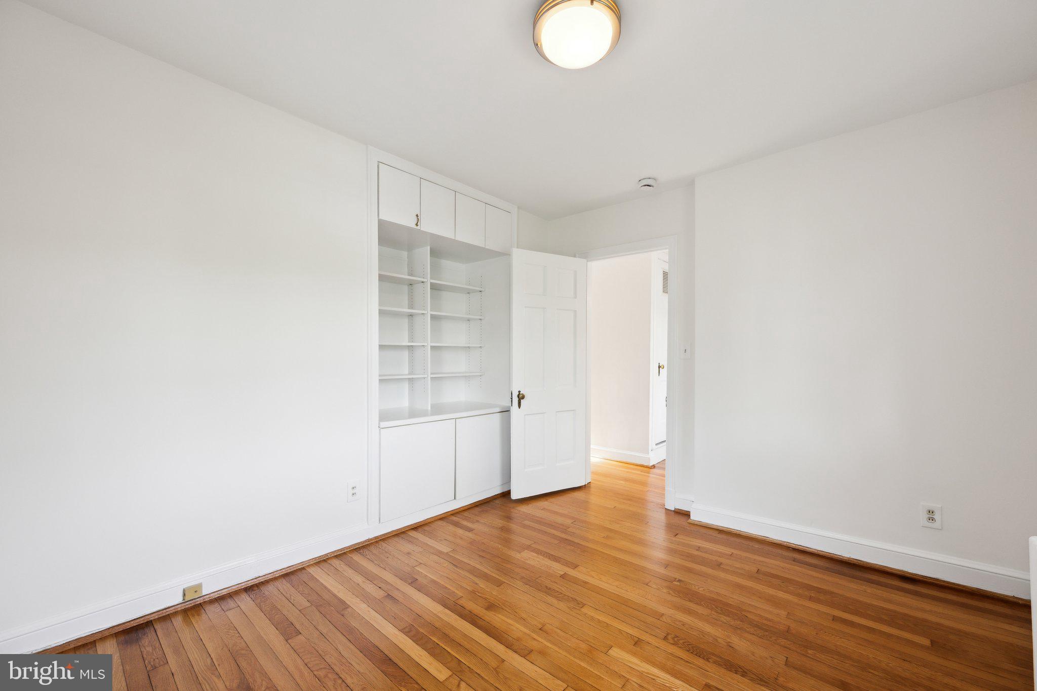 7820 Custer Road Bethesda, MD 20814 - Photo 15 of 29 a view of wooden floor and windows in a room