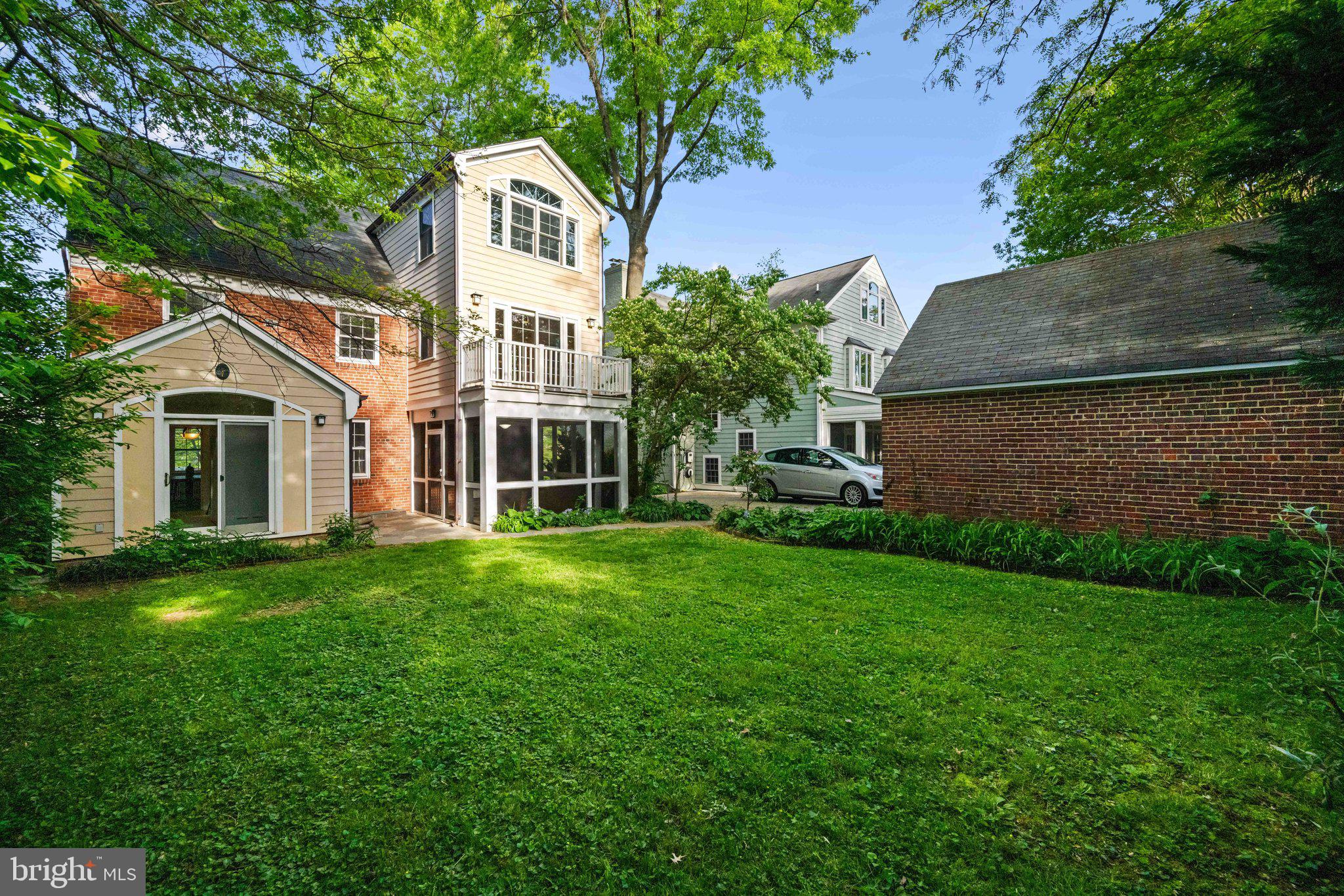 7820 Custer Road Bethesda, MD 20814 - Photo 25 of 29 a front view of a house with a garden