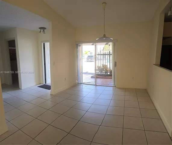 a view of an empty room and window