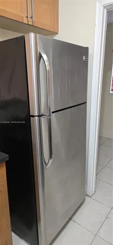 a close view of a refrigerator a washer and dryer