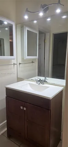 a white bath tub sitting next to a toilet