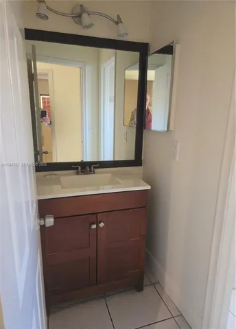 a view of a livingroom with an empty space and a window