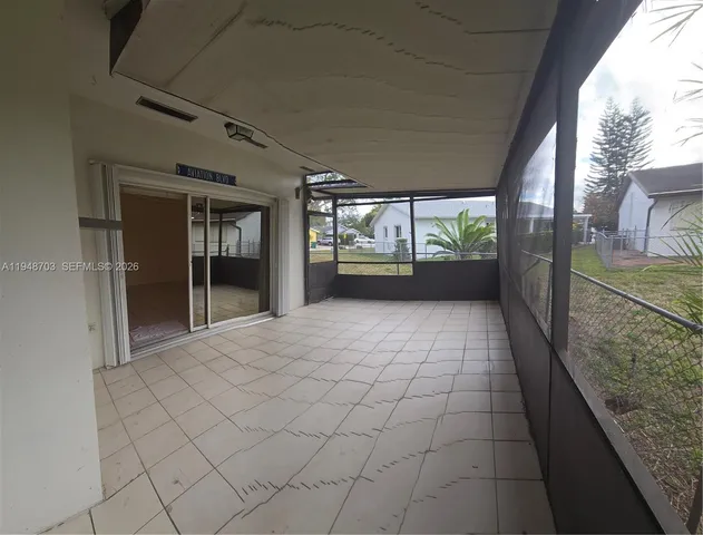 a view of empty room with windows