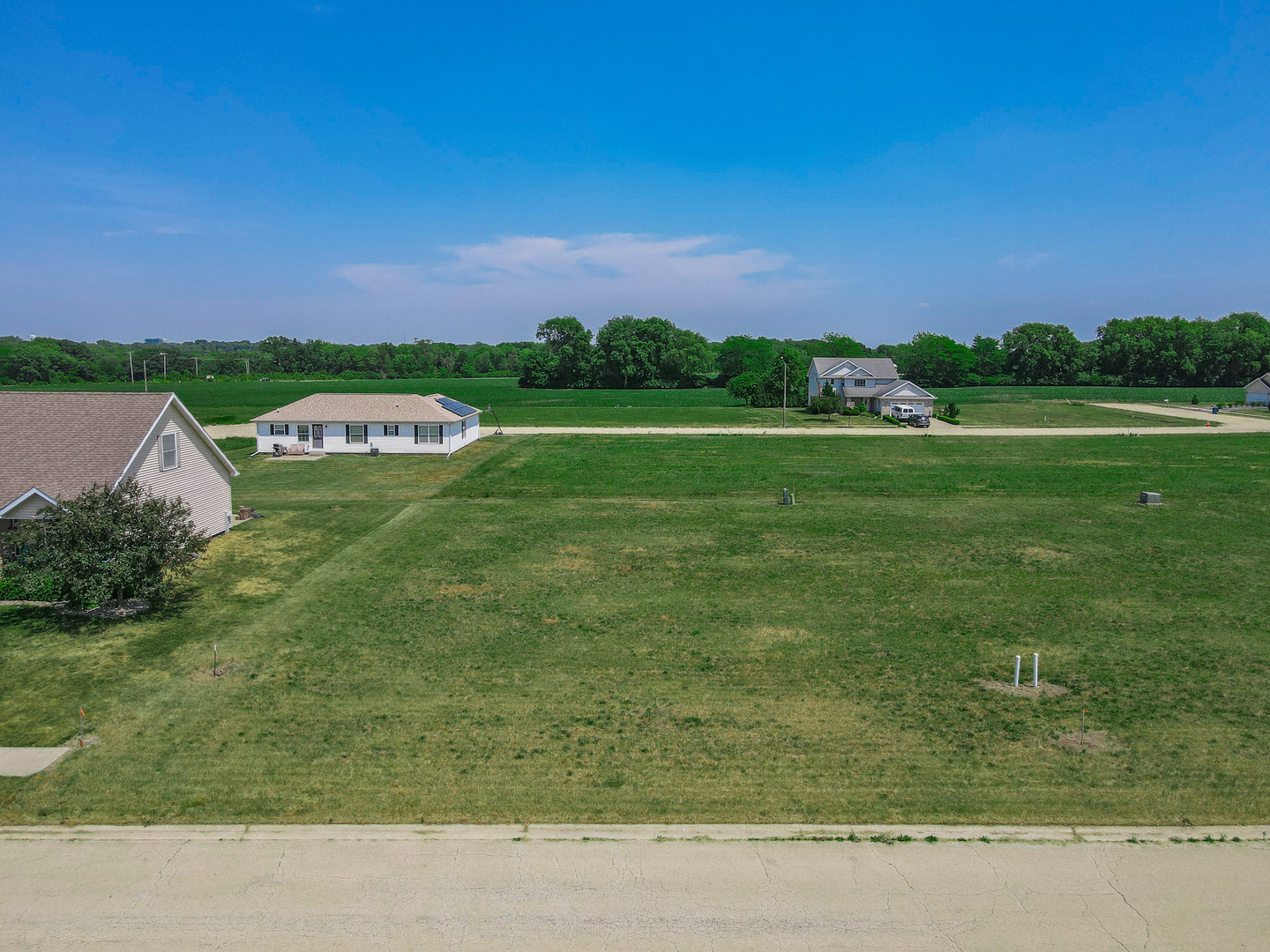 a view of a field with an trees