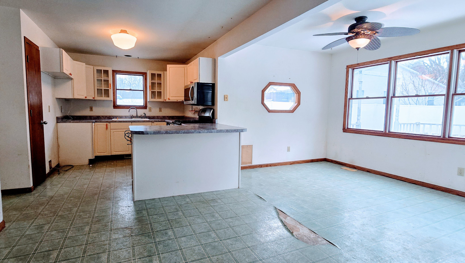 1115 South Clapper Court Mahomet, IL 61853 - Photo 2 of 16 a kitchen with stainless steel appliances granite countertop a stove top oven a sink a counter top space and cabinets