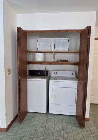 a utility room with cabinets