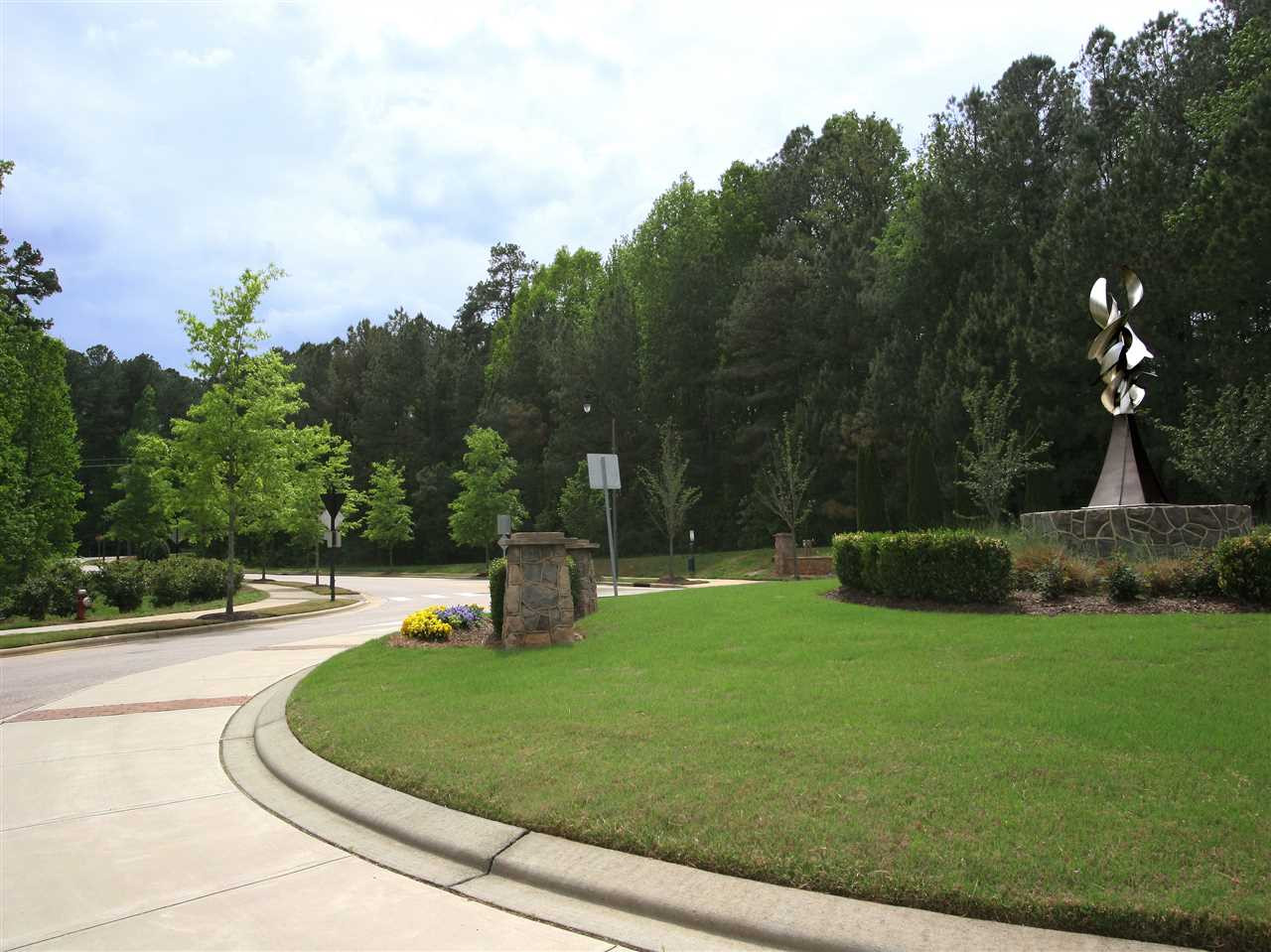 1517 Rodessa Run Raleigh, NC 27607 - Photo 23 of 25 Neighborhood entrances have landscaped areas with art installations. Umstead State Park and Schenck Memorial Forest are nearby. Neighborhood Entrance
