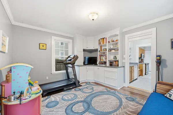 a room with furniture and a wooden floor