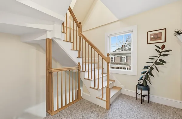 a view of entryway with a window and stairs