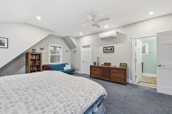 a bed room with a bed and a dresser