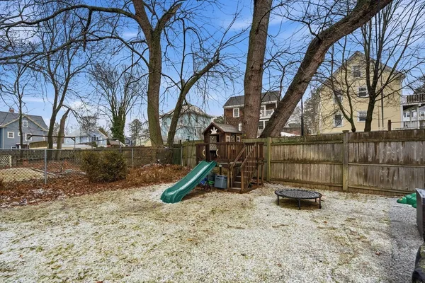 a backyard of a house with lots of green space