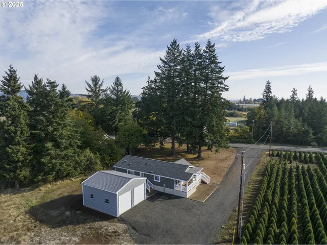 an aerial view of a house with outdoor space