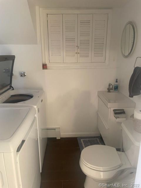 11 Shawnee Road Trumbull, CT 06611 - Photo 11 of 14 a bathroom with a toilet and a sink