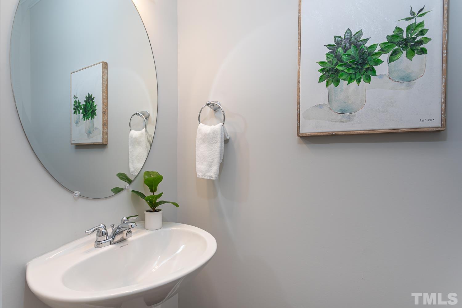 6531 Tremolo Trail Raleigh, NC 27616 - Photo 6 of 13 a bathroom with a sink and a mirror