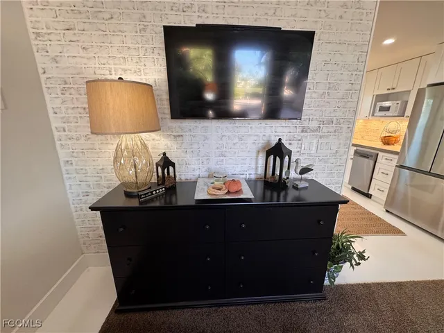 a kitchen with a sink and a microwave