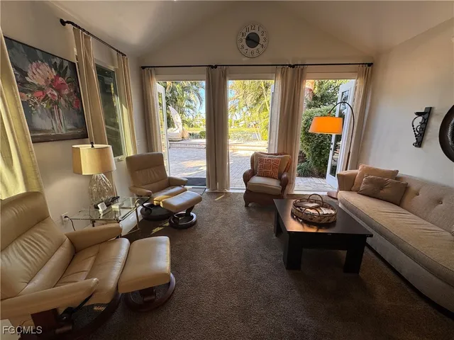 a large white kitchen with cabinets