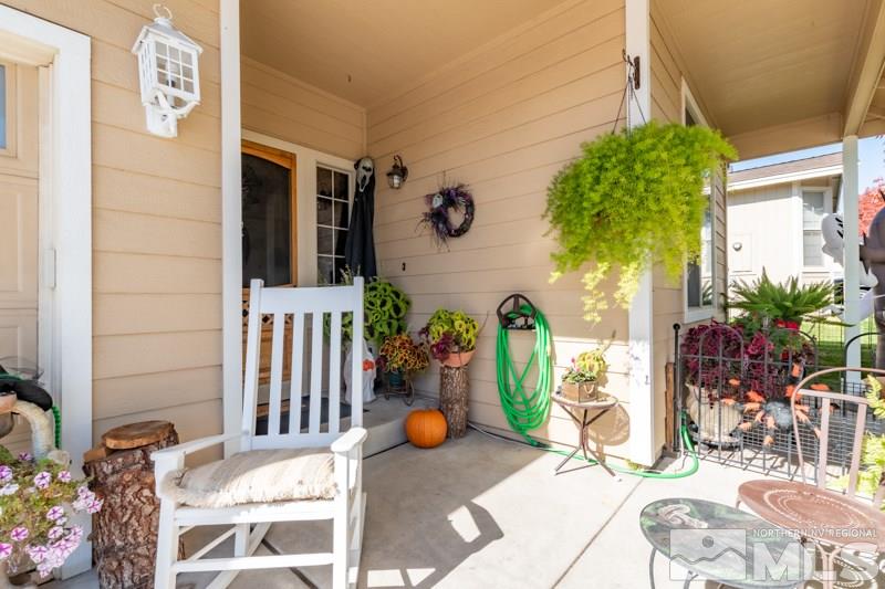 2771 Harding Way Reno, NV 89503 - Photo 3 of 24 a view of a patio with table and chairs potted plants