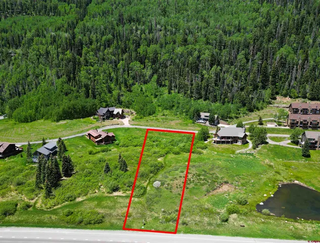 a backyard of a house with a yard and seating area