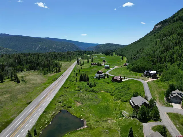 a view of a garden with a building in the background